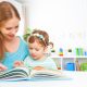 mother and child reading book at home